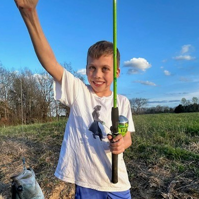 Eli smiling after fishing.